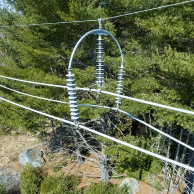 115kV spacer midspan with trees in the background