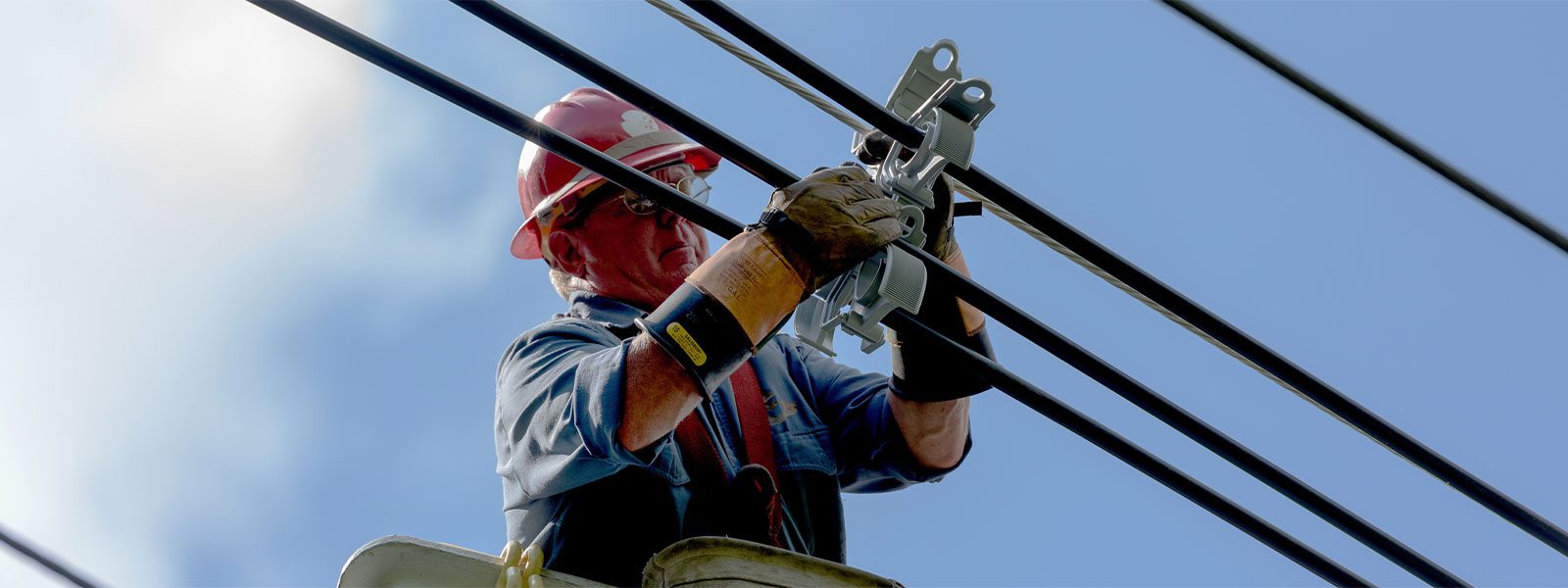 Lineman Installing A Spacer