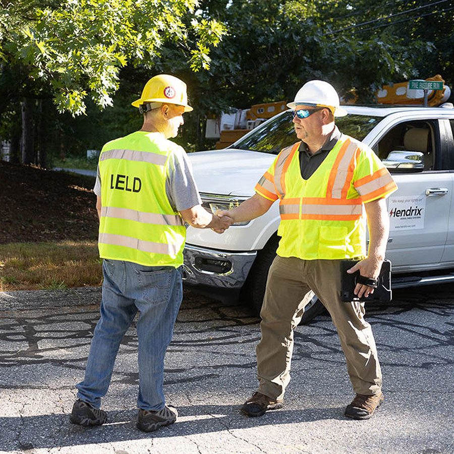 Utility Foreman Shaking Hands With Hendrix Field Rep