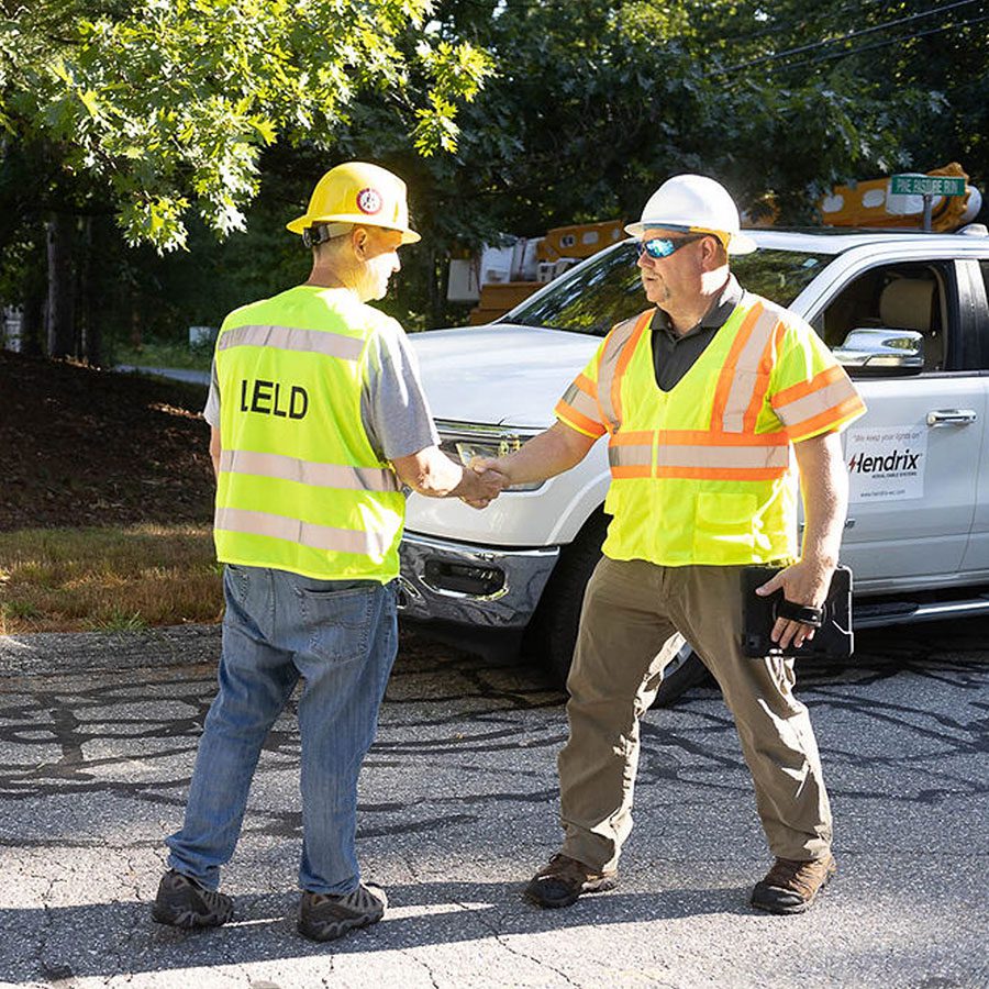 Utility Foreman Shaking Hands With Hendrix Field Rep