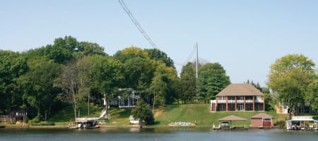 Lake-side home with a power line in the background