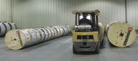 Reels of Hendrix Cable being moved by forklift