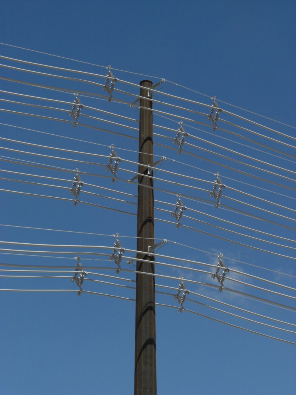 Multiple spacer cable systems installed on the same pole